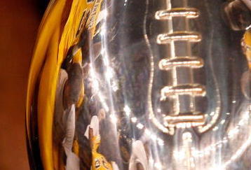 NEW ORLEANS - DECEMBER 21: Ronnie Thornton #56 of the Southern Mississippi Golden Eagles celebrates by kissing the trophy after defeating the Troy Trojans 30-27 in overtime to win the R+L Carriers New Orleans Bowl on December 21, 2008 at the Superdome in New Orleans, Louisiana. (Photo by Chris Graythen/Getty Images)
