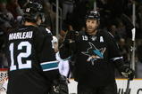 SAN JOSE, CA - DECEMBER 04:  Joe Thornton #19 of the San Jose Sharks celebrates with Patrick Marleau #12 after Marleau scored a second period power play goal against the Columbus Blue Jackets during the NHL game at HP Pavilion on December 4, 2008 in San Jose, California.  (Photo by Christian Petersen/Getty Images)