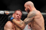 LAS VEGAS - NOVEMBER 21: Ben Saunders (R) battles Marcus Davis (L) during their Welterweight Fight at the UFC 106 at Mandalay Bay Events Center on November 21, 2009 in Las Vegas, Nevada. (Photo by Jon Kopaloff/Getty Images)
