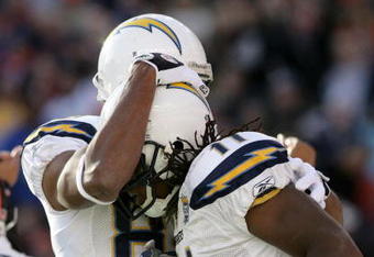 DENVER - NOVEMBER 22:  Legedu Naanee #11 of the San Diego Chargers is congratulated by Malcom Floyd #80 after his first quarter touchdown against the Denver Broncos during NFL action at Invesco Field at Mile High on November 22, 2009 in Denver, Colorado.  (Photo by Doug Pensinger/Getty Images)