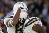 DENVER - NOVEMBER 22:  Legedu Naanee #11 of the San Diego Chargers is congratulated by Malcom Floyd #80 after his first quarter touchdown against the Denver Broncos during NFL action at Invesco Field at Mile High on November 22, 2009 in Denver, Colorado.  (Photo by Doug Pensinger/Getty Images)