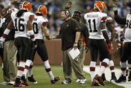 DETROIT, MI - NOVEMBER 22: Head coach Eric Mangini of the Cleveland Browns congratulates quarterback Brady Quinn #10 after a touchdown pass against the Detroit Lions at Ford Field on November 22, 2009 in Detroit, Michigan. The Lions came from behind to defeat the Browns 38-37. (Photo by Joe Robbins/Getty Images)