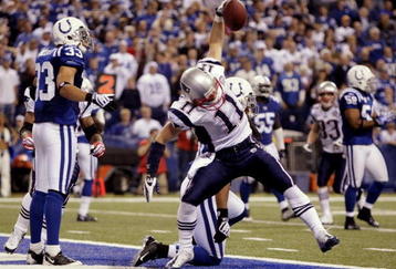 INDIANAPOLIS - NOVEMBER 15:  Julian Edelman #11 of the New England Patriots celebrates his touchdown in the second quarter of the game against the Indianapolis Colts at Lucas Oil Stadium on November 15, 2009 in Indianapolis, Indiana.  (Photo by Jamie Squire/Getty Images)