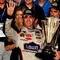HOMESTEAD, FL - NOVEMBER 22:  Jimmie Johnson, driver of the #48 Lowe's Chevrolet, celebrates after winning the NASCAR Sprint Cup Series Championship after finishing in fifth place in the Ford 400 at Homestead-Miami Speedway on November 22, 2009 in Homestead, Florida. Johnson becomes the first driver in the history of NASCAR to win four consecutive championships since the sports inception in 1949.during the NASCAR Sprint Cup Series Ford 400 at Homestead-Miami Speedway on November 22, 2009 in Homestead, Florida.  (Photo by Sam Greenwood/Getty Images)