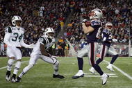 FOXBORO, MA - NOVEMBER 22:  Wes Welker #83 of the New England Patriots catches a punt as Wallace Wright #15 and Marquis Cole #34 of the New York Jets defend on November 22, 2009 at Gillette Stadium in Foxboro, Massachusetts.  (Photo by Elsa/Getty Images)