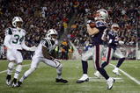 FOXBORO, MA - NOVEMBER 22:  Wes Welker #83 of the New England Patriots catches a punt as Wallace Wright #15 and Marquis Cole #34 of the New York Jets defend on November 22, 2009 at Gillette Stadium in Foxboro, Massachusetts.  (Photo by Elsa/Getty Images)