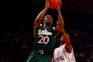 NEW YORK - MARCH 10:  Dominique Jones #20 of the USF Bulls goes to the hoop against Eugene Harvey #20 of the Seton Hall Pirates during the first round of the Big East Tournament at Madison Square Garden on March 10, 2009 in New York City.  (Photo by Jim McIsaac/Getty Images)