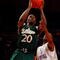 NEW YORK - MARCH 10:  Dominique Jones #20 of the USF Bulls goes to the hoop against Eugene Harvey #20 of the Seton Hall Pirates during the first round of the Big East Tournament at Madison Square Garden on March 10, 2009 in New York City.  (Photo by Jim McIsaac/Getty Images)