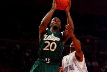 NEW YORK - MARCH 10:  Dominique Jones #20 of the USF Bulls goes to the hoop against Eugene Harvey #20 of the Seton Hall Pirates during the first round of the Big East Tournament at Madison Square Garden on March 10, 2009 in New York City.  (Photo by Jim McIsaac/Getty Images)