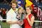 NEW YORK - SEPTEMBER 13:  Kim Clijsters of Belgium poses with the championship trophy alongside husband Brian Lynch and daughter Jada after defeating Caroline Wozniacki of Denmark in the Women�s Singles final on day fourteen of the 2009 U.S. Open at the USTA Billie Jean King National Tennis Center on September 13, 2009 in the Flushing neighborhood of the Queens borough of New York City. Clijsters defeated Wozniacki 7-5, 6-3.  (Photo by Julian Finney/Getty Images)