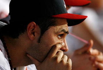 ATLANTA - JUNE 26:  Pitcher Mike Gonzalez #51 of the Atlanta Braves looks on from the dugout in the bottom of the ninth inning against the Boston Red Sox at Turner Field on June 26, 2009 in Atlanta, Georgia.  (Photo by Kevin C. Cox/Getty Images)