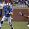 DETROIT, MI - NOVEMBER 22: Matthew Stafford #9 of the Detroit Lions runs with the football against the Cleveland Browns at Ford Field on November 22, 2009 in Detroit, Michigan. The Lions came from behind to defeat the Browns 38-37. (Photo by Joe Robbins/Getty Images)