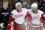 MONTREAL- NOVEMBER 21:  Niklas Kronwall #55 of the Detroit Red Wings is helped off of the ice after being tripped by Georges Laraque #17 of the Montreal Canadiens during the NHL game on November 21, 2009 at the Bell Centre in Montreal, Quebec, Canada.  (Photo by Richard Wolowicz/Getty Images)