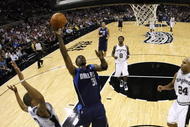 SAN ANTONIO - NOVEMBER 11: Jason Terry #31 of the Dallas Mavericks shoots a layup against George Hill #3 and Richard Jefferson #24 of the San Antonio Spurs during the game at AT&T Center on November 11, 2009 in San Antonio, Texas.  NOTE TO USER: User expressly acknowledges and agrees that, by downloading and or using this photograph, User is consenting to the terms and conditions of the Getty Images License Agreement. (Photo by Ronald Martinez/Getty Images)