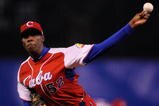 MEXICO CITY - MARCH 10:  Aroldis Chapman #52 of Cuba pitches against Australia during the first inning of the game during the 2009 World Baseball Classic Pool B match on March 10, 2009 at the Estadio Foro Sol in Mexico City, Mexico.  (Photo by Kevork Djansezian/Getty Images)