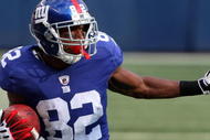 EAST RUTHERFORD, NJ - SEPTEMBER 13:  Mario Manningham #82 of the New York Giants runs in a second quarter touchdown against the Washington Redskins on September 13, 2009 at Giants Stadium in East Rutherford, New Jersey.  (Photo by Jim McIsaac/Getty Images)