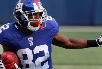 EAST RUTHERFORD, NJ - SEPTEMBER 13:  Mario Manningham #82 of the New York Giants runs in a second quarter touchdown against the Washington Redskins on September 13, 2009 at Giants Stadium in East Rutherford, New Jersey.  (Photo by Jim McIsaac/Getty Images)