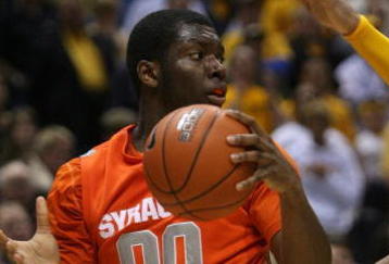 MILWAUKEE - MARCH 07: Rick Jackson #00 of the Syracuse Orange looks to pass under pressure from Lazar Hayward #32 of the Marquette Golden Eagles on March 7, 2009 at the Bradley Center in Milwaukee, Wisconsin. Syracuse defeated Marquette 86-79 in overtime. (Photo by Jonathan Daniel/Getty Images)