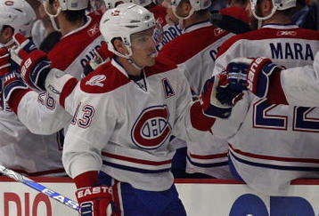 CHICAGO - OCTOBER 30: Michael Cammalleri #13 of the Montreal Canadiens is congratulated by teammates after scoring a second period goal against the Chicago Blackhawks at the United Center on October 30, 2009 in Chicago, Illinois. (Photo by Jonathan Daniel/Getty Images)