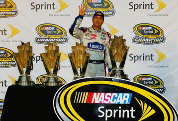HOMESTEAD, FL - NOVEMBER 22:  Jimmie Johnson, driver of the #48 Lowe's Chevrolet, poses with all four of his championship trophies after winning the NASCAR Sprint Cup Series Championship at Homestead-Miami Speedway on November 22, 2009 in Homestead, Florida. Johnson becomes the first driver in the history of NASCAR to win four consecutive championships since the sports inception in 1949.  (Photo by Jason Smith/Getty Images for NASCAR)