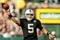 OAKLAND, CA - NOVEMBER 22:  Bruce Gradkowski #5 of the Oakland Raiders throws the ball during their game against the Cincinnati Bengals at Oakland-Alameda County Coliseum on November 22, 2009 in Oakland, California.  (Photo by Ezra Shaw/Getty Images)