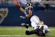 ST. LOUIS - NOVEMBER 15: Brandon Gibson #11 of the St. Louis Rams is tackled by Leigh Torrence #24 of the New Orleans Saints at the Edward Jones Dome on November 15, 2009 in St. Louis, Missouri.  The Saints beat the Rams 28-23.  (Photo by Dilip Vishwanat/Getty Images)