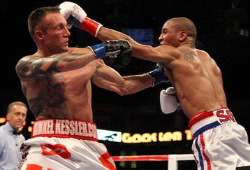 OAKLAND, CA - NOVEMBER 21:  Mikkel Kessler of Denmark (L) is hit by Andre Ward during their WBA Super Middleweight Championship Bout at the Oakland-Alameda County Coliseum on November 21, 2009 in Oakland, California.  (Photo by Jed Jacobsohn/Getty Images)
