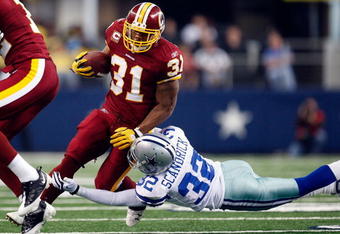 ARLINGTON, TX - NOVEMBER 22:  Running back Rock Cartwright #31 of the Washington Redskins runs the ball against Orlando Scandrick #32 of the Dallas Cowboys at Cowboys Stadium on November 22, 2009 in Arlington, Texas.  (Photo by Ronald Martinez/Getty Images)
