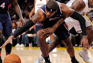 LOS ANGELES, CA - NOVEMBER 01: Ron Artest #37 of the Los Angeles Lakers forces a turn over against Josh Smith #5 of the Atlanta Hawks during the NBA basketball game at Staples Center on November 1, 2009 in Los Angeles, California. NOTE TO USER: User expressly acknowledges and agrees that, by downloading and/or using this Photograph, user is consenting to the terms and conditions of the Getty Images License Agreement. (Photo by Kevork Djansezian/Getty Images)