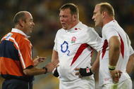 BRISBANE, AUSTRALIA - JUNE 26: (L-R) Referee Paddy O'Brien speaks with Steve Thompson and Lawrence Dallaglio of England during the rugby union international match between the Australian Wallabies and England for the Cook Cup at Suncorp Stadium June 26, 2004 in Brisbane, Australia. (Photo by Nick Laham/Getty Images)