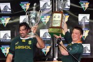 HAMILTON, NEW ZEALAND - SEPTEMBER 12: Victor Matfield of South Africa holds the Tri Nations trophy and team mate John Smit holds the Freedom Cup after winning the Tri Nations Test between the New Zealand All Blacks and South African Springboks at Waikato Stadium on September 12, 2009 in Hamilton, New Zealand. on September 12, 2009 in Hamilton, New Zealand. (Photo by Tertius Pickard/Gallo Images/Getty Images)