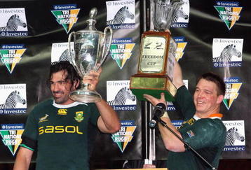 HAMILTON, NEW ZEALAND - SEPTEMBER 12: Victor Matfield of South Africa holds the Tri Nations trophy and team mate John Smit holds the Freedom Cup after winning the Tri Nations Test between the New Zealand All Blacks and South African Springboks at Waikato Stadium on September 12, 2009 in Hamilton, New Zealand. on September 12, 2009 in Hamilton, New Zealand. (Photo by Tertius Pickard/Gallo Images/Getty Images)