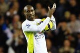 LONDON, ENGLAND - NOVEMBER 22:  Jermain Defoe of Tottenham Hotspur collects the match ball after scoring five during the Barclays Premier League match between Tottenham Hotspur and Wigan Athletic at White Hart Lane on November 22, 2009 in London, England.  (Photo by Clive Rose/Getty Images)