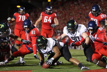 TUCSON, AZ - NOVEMBER 21:  Defensive end Will Tukuafu #39 of the Oregon Ducks recovers a fumble from David Roberts #81 of the Arizona Wildcats in the endzone during the college football game at Arizona Stadium on November 21, 2009 in Tucson, Arizona. The Ducks defeated the Wildcats 44-41 in second overtime. (Photo by Christian Petersen/Getty Images)