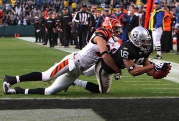 OAKLAND, CA - NOVEMBER 22:  Louis Murphy #18 of the Oakland Raiders catches a touchdown pass over Morgan Trent #25 of the Cincinnati Bengals in the fourth quarter to tie the gameduring an NFL game at Oakland-Alameda County Coliseum on November 22, 2009 in Oakland, California.  (Photo by Jed Jacobsohn/Getty Images)