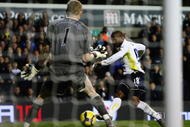 LONDON, ENGLAND - NOVEMBER 22:  Jermain Defoe of Tottenham Hotspur scores his fifth goal during the Barclays Premier League match between Tottenham Hotspur and Wigan Athletic at White Hart Lane on November 22, 2009 in London, England.  (Photo by Clive Rose/Getty Images)