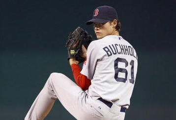 KANSAS CITY, MO - SEPTEMBER 24: Starting pitcher Clay Buchholz #61 of the Boston Red Sox pitches during the game against the Kansas City Royals on September 24, 2009 at Kauffman Stadium in Kansas City, Missouri. (Photo by Jamie Squire/Getty Images)