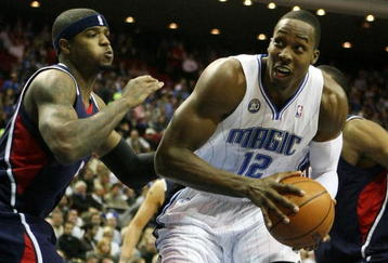 ORLANDO, FL - OCTOBER 29:  Dwight Howard #2 of the Orlando Magic looks to go up against Josh Smith #5 the Atlanta Hawks at Amway Arena on October 29, 2008 in Orlando, Florida. NOTE TO USER: User expressly acknowledges and agrees that, by downloading and/or using this Photograph, user is consenting to the terms and conditions of the Getty Images License Agreement.  (Photo by Doug Benc/Getty Images)