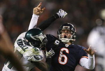 CHICAGO - NOVEMBER 22: Jay Cutler #6 of the Chicago Bears is hit by Quintin Mikell #27 of the Philadelphia Eagles as Cutler throws a 15-yard touchdown in the third quarter at Soldier Field on November 22, 2009 in Chicago, Illinois.  (Photo by Jonathan Daniel/Getty Images)