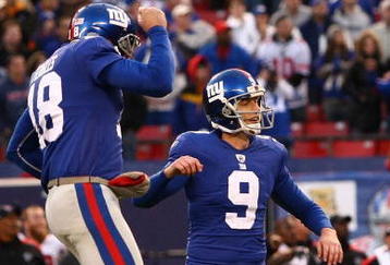 EAST RUTHERFORD, NJ - NOVEMBER 22: Jeff Feagles #18 of the New York Giants celebrates as Lawrence Tynes scores the winning goal in overtime against the  Atlanta Falcons of the the New York Giants on November 22, 2009 at Giants Stadium in East Rutherford, New Jersey.  (Photo by Chris McGrath/Getty Images)