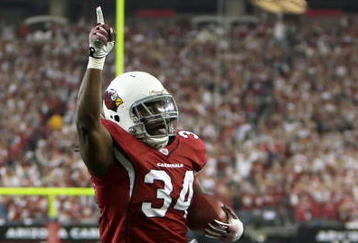 GLENDALE, AZ - JANUARY 03:  Runningback Tim Hightower #34 of the Arizona Cardinals celebrates after scoring a 4 yard rushing touchdown against the Atlanta Falcons during the third quarter of the NFC Wild Card Game on January 3, 2009 at University of Phoenix Stadium in Glendale, Arizona.  (Photo by Jed Jacobsohn/Getty Images)