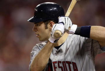 ST. LOUIS, MO - JULY 14:  American League All-Star Joe Mauer of the Minnesota Twins bats during the 2009 MLB All-Star Game at Busch Stadium on July 14, 2009 in St Louis, Missouri. (Photo by Jamie Squire/Getty Images)