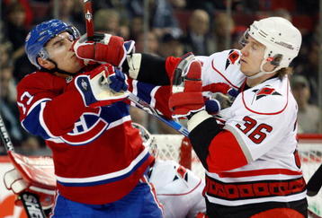 MONTREAL- NOVEMBER 17:  Jussi Jokinen #36 of the Carolina Hurricanes and Mike Cammalleri #13 of the Montreal Canadiens mix it up during the NHL game on November 17, 2009 at the Bell Centre in Montreal, Quebec, Canada.  The Canadiens defeated the Hurricanes 3-2 in a shootout.  (Photo by Richard Wolowicz/Getty Images)