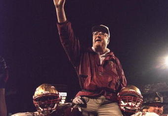 1 Jan 1996:  Head coach Bobby Bowden of the Florida State Seminoles is carried triumphantly off the field by nose guard Andre Wadsworth #8 and tackle Orpheus Roy after defeating the Notre Dame Fighting Irish in the Orange Bowl in Miami, Florida 31-26.  Ma