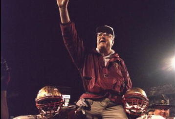 1 Jan 1996:  Head coach Bobby Bowden of the Florida State Seminoles is carried triumphantly off the field by nose guard Andre Wadsworth #8 and tackle Orpheus Roy after defeating the Notre Dame Fighting Irish in the Orange Bowl in Miami, Florida 31-26.  Ma
