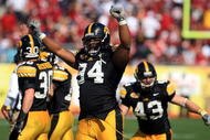 TAMPA, FL - JANUARY 01:  Adrian Clayborn #94 of the Iowa Hawkeyes celebrates after an interception against the South Carolina Gamecocks during the Outback Bowl on January 1, 2009 at Raymond James Stadium in Tampa, Florida.  (Photo by Scott Halleran/Getty Images)