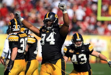 TAMPA, FL - JANUARY 01:  Adrian Clayborn #94 of the Iowa Hawkeyes celebrates after an interception against the South Carolina Gamecocks during the Outback Bowl on January 1, 2009 at Raymond James Stadium in Tampa, Florida.  (Photo by Scott Halleran/Getty Images)