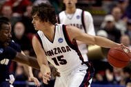 PORTLAND, OR - MARCH 19:  Matt Bouldin #15 of the Gonzaga Bulldogs drives on Darryl Roberts #12 of the Akron Zips in the second half during the first round of the NCAA Division I Men's Basketball Tournament at the Rose Garden on March 19, 2009 in Portland, Oregon.  (Photo by Jonathan Ferrey/Getty Images)