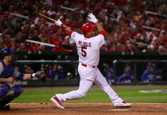 ST. LOUIS, MO - OCTOBER 10:  Albert Pujols #5 of the St. Louis Cardinals hits an RBIsingle against the Los Angeles Dodgers in the eighth inning of Game Three of the NLDS during the 2009 MLB Playoffs at Busch Stadium on October 10, 2009 in St. Louis, Missouri. (Photo by Dilip Vishwanat/Getty Images)