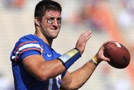 GAINESVILLE, FL - NOVEMBER 21: Quarterback Tim Tebow #15 of the Florida Gators warms up for play against the Florida International University Golden Panthers November 21, 2009 at Ben Hill Griffin Stadium in Gainesville, Florida.  (Photo by Al Messerschmidt/Getty Images)